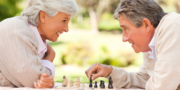 senior couple playing chess