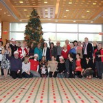 Tapestry Community In Front of Christmas Tree